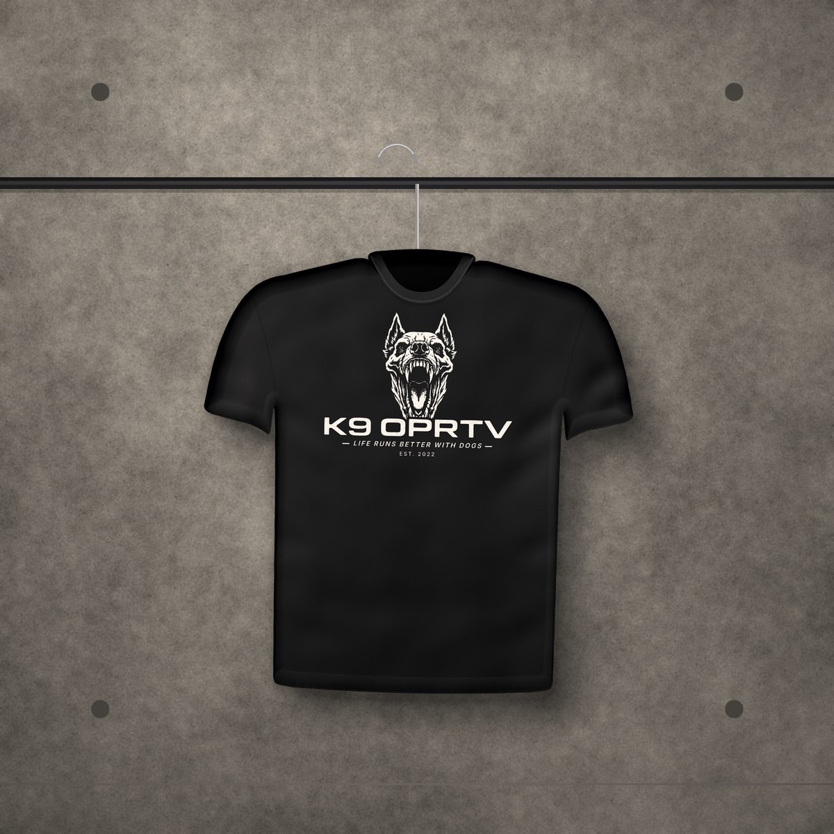 Primal Tee hanging on concrete wall